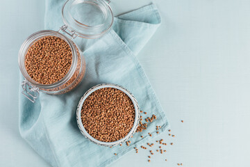 Buckwheat groats close up. Grains of raw buckwheat as a abstract background texture.