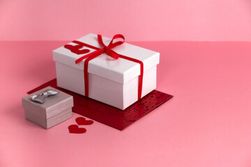 St. Valentine's Day gifts in white boxes, copy space on pink