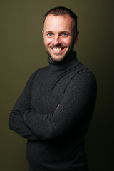 Portrait of a man in front of a colored background