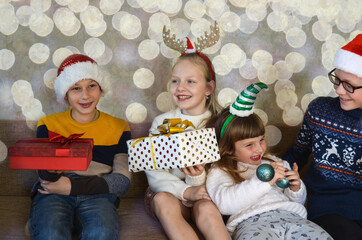 Obraz na płótnie Canvas Happy caucasian family celebrating christmas holiday at home. Children having fun together lifestyle