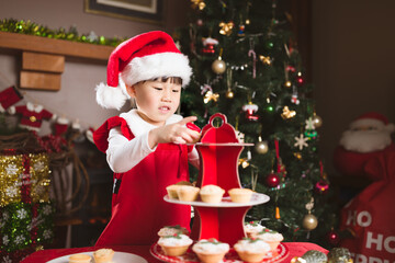 young girl preparing mince pie for celebrating  Christmas party