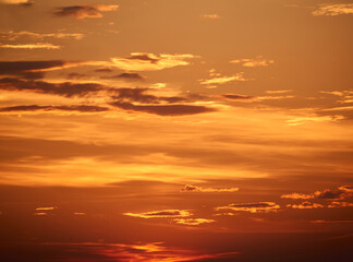 background - bright orange sunset sky with clouds
