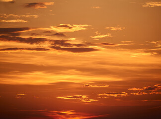 Fototapeta premium background - bright orange sunset sky with clouds