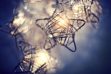 Fototapeta na wymiar Christmas luminous garland in the shape of stars