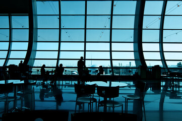 Silhouette in the Airport Terminal Lounge Viewing Plane
