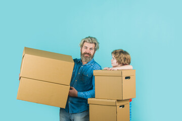 Delivery. Mail. Bearded man and boy carry boxes. Happy son and father with cardboard box. Internet purchases and e-commerce concept. Delivery concept.