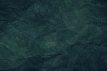 Texture of crumpled old paper in Tidewater Green color. Dark empty wood background. Rough, rough surface. Abstract background.