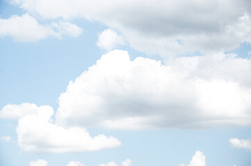 Blue sky background with a clean white fluffy cloud, natural nature, summer, air