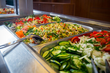 Served vegetarian salad tasty meal in restaurant close up view.