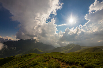 Beautiful mountain landscape at Caucasus mountains with clouds and cloudy sky
