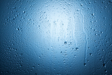 Drops of clear water on the glass. Background