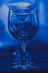 glass of water on blue