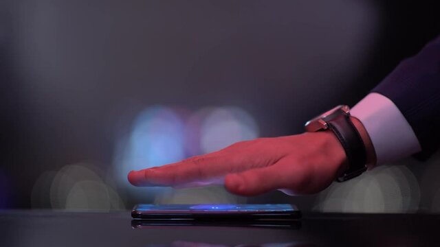 Hand over Phone Reveals Hologram Word AFTER-HOURS DEALING