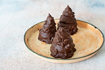 Fludebolle (Fludebolly) Denmark's national dessert. Cake made from Italian meringue (egg white cream), shortcrust pastry, covered with dark chocolate. Delicious Chocolate Dessert.