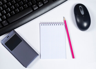 Ready to work,Minimal work space with Computer Keyboard,mouse,notebook,smartphone on white background,top view. For placing your text 