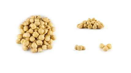 A handful of hazelnuts on a white background
