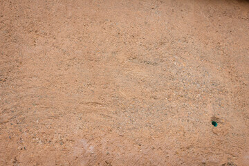 Rain water leaks on the wall causing damage and peeling paint