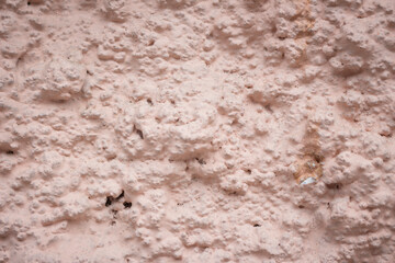 Rain water leaks on the wall causing damage and peeling paint