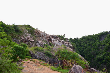 Beautiful scenery and sky with green trees, white and gold clouds. And the mountains before sunset the sunset from the top of the mountain