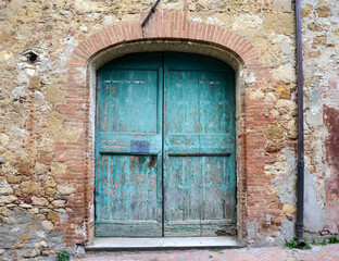 Doors and elements of the old Italian village in Certaldo, Italy