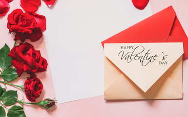 St Valentine's Day concept. Red rose and Envelope with text Happy Valentine's Day.