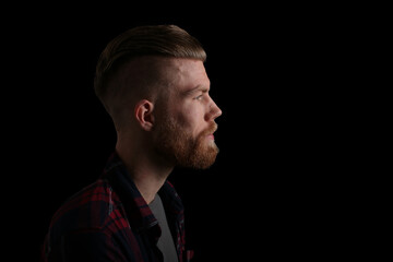 Portrait of a man in front of a colored background