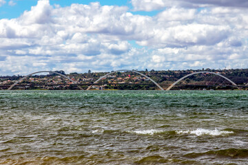 View of the bridge over the lake. JK Bridge. Brasília, the capital of Brazil. Cityscape. Clouds in the sky.