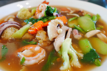 Close up.Fried noodle with seafood pork and kaletra in Gravy sauce can find on street food and easy meal to eat Thai'people called 