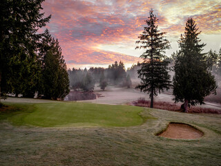 Fog and sunrise on a golf course