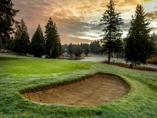 Fog and sunrise on a golf course