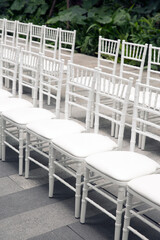 Row of white chairs in party event