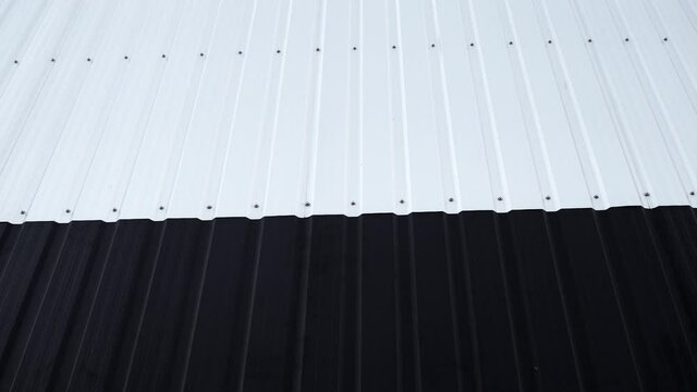 Black and white Corrugated metal sheet surface of the wall. Galvanize steel background.