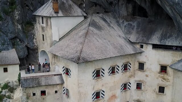 Architectural details of a medieval castle built inside cave mouth in Slovenia