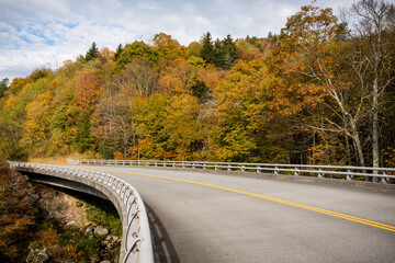 An afternoon ride along the Blue Ridge Parkway at the Linn cove viaduct in North Carolina near Asheville. - 397133960