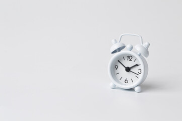 Front view of white clock isolated on a white background.