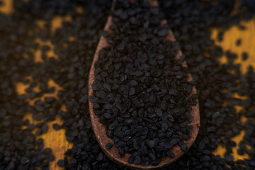 small chive organic seeds on a spoon