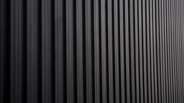 Black Corrugated metal sheet surface of the wall. Galvanize steel background.
