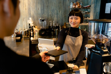 Waitress giving bill to customer after he finished food.