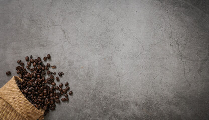 Coffee cup and beans on old kitchen table. Top view with copyspace for your text