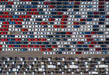 Aerial top down photo of new cars and trucks at a shipping port in Australia