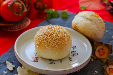 Homemade baked bread with sesame on the top close up.