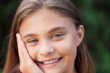 Portrait of a Smiling Young Girl