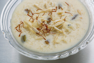 kheer or rice pudding is an Indian dessert in a bowl with dry fruits toppings