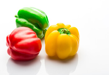 colorful bell peppers isolated on white background