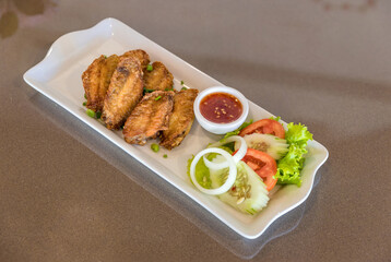 Fried Chicken Wings. Fried chicken wings with fish sauce is a popular menu in Thai restaurants.