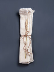 The concept of ecological etiquette - three reusable string bags with a branche of wheat folded by the rope.