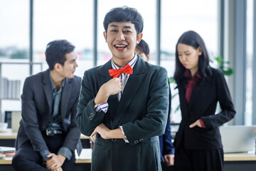 Successful company,executive Young Asian Homosexual businessman LGBT partners with happy workers Group of asian business people with diverse genders (LGBT) in the meeting room at office