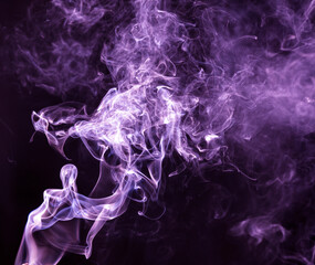 Purple smoke isolated on black background. Abstraction