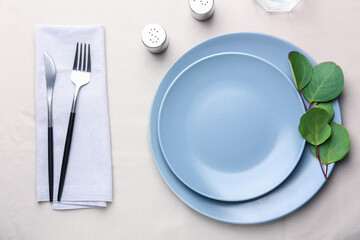 Simple table setting with eucalyptus on table