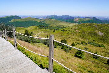 Stairs wooden pathway trail access of the Puy de Dome volcano mountain in france